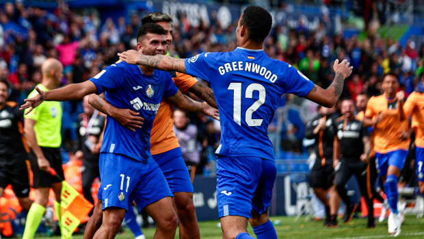 Mason Greenwood pictured celebrating with his Getafe teammates during a 3-2 win over Osasuna on his La Liga debut in September 2023